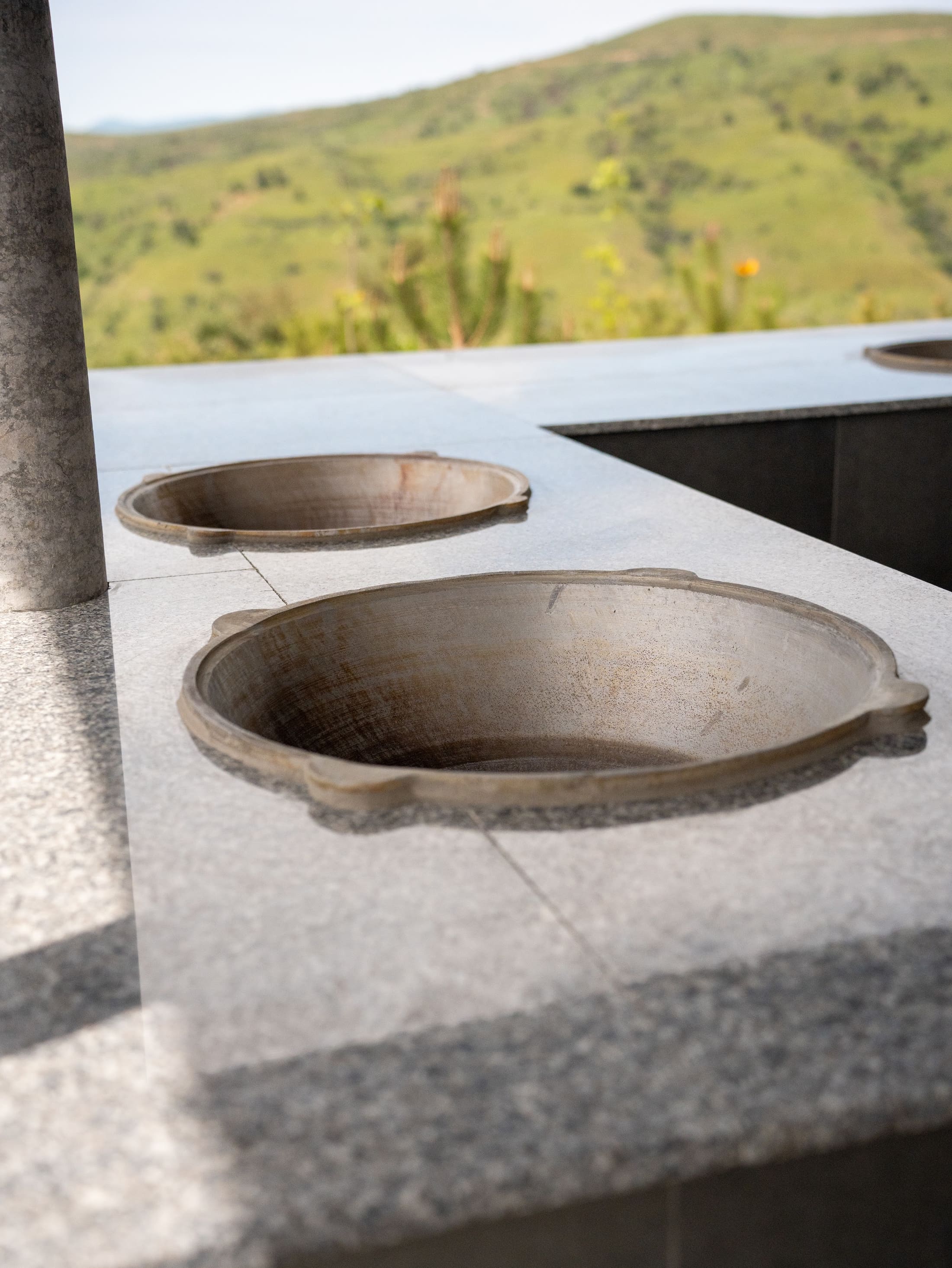 Kazan pots built into a stone hearth